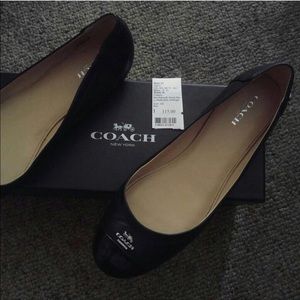Black coach flat shoes